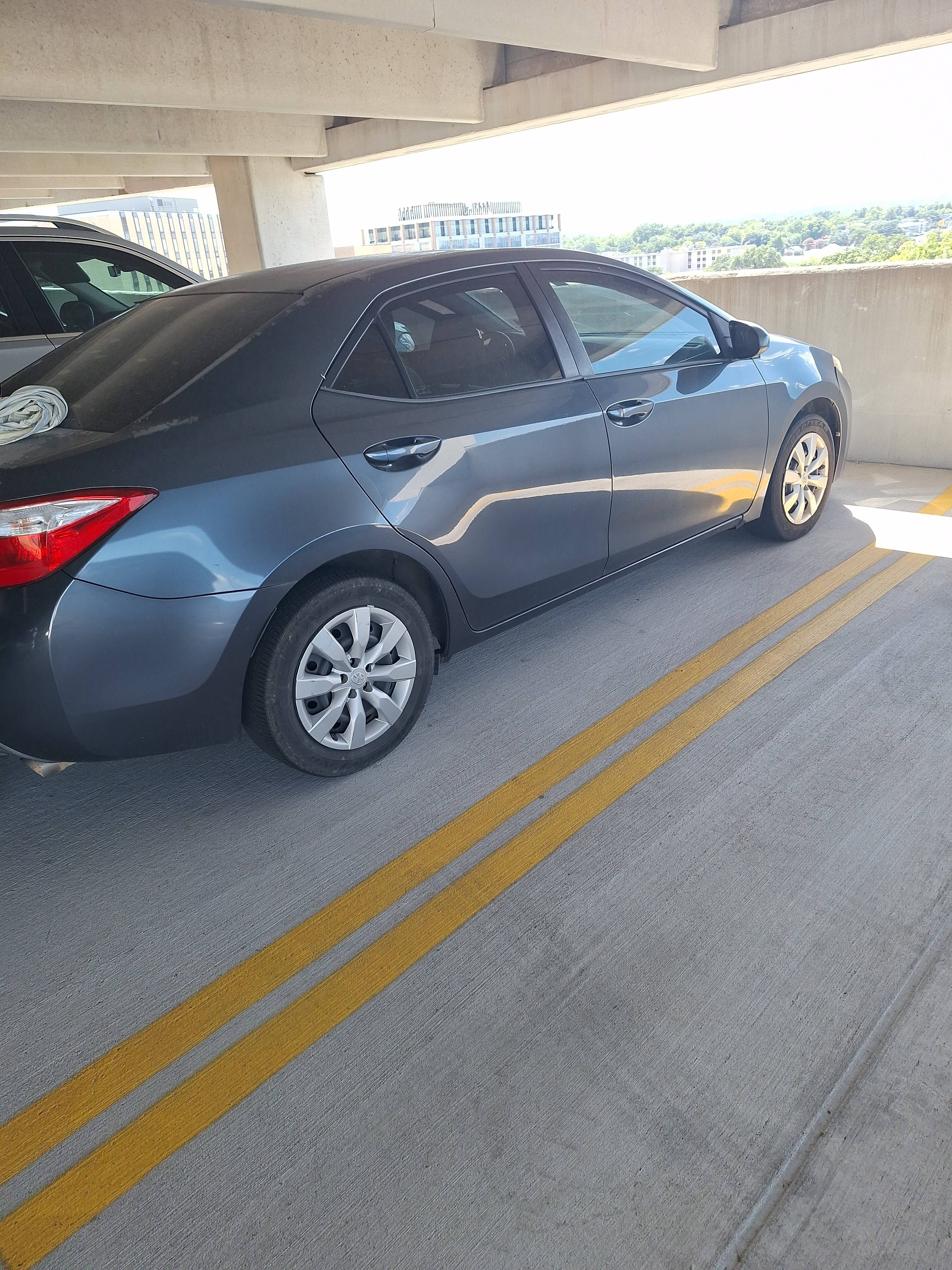Car Lockout Service in Parking garage — 2015 Toyota Corolla
